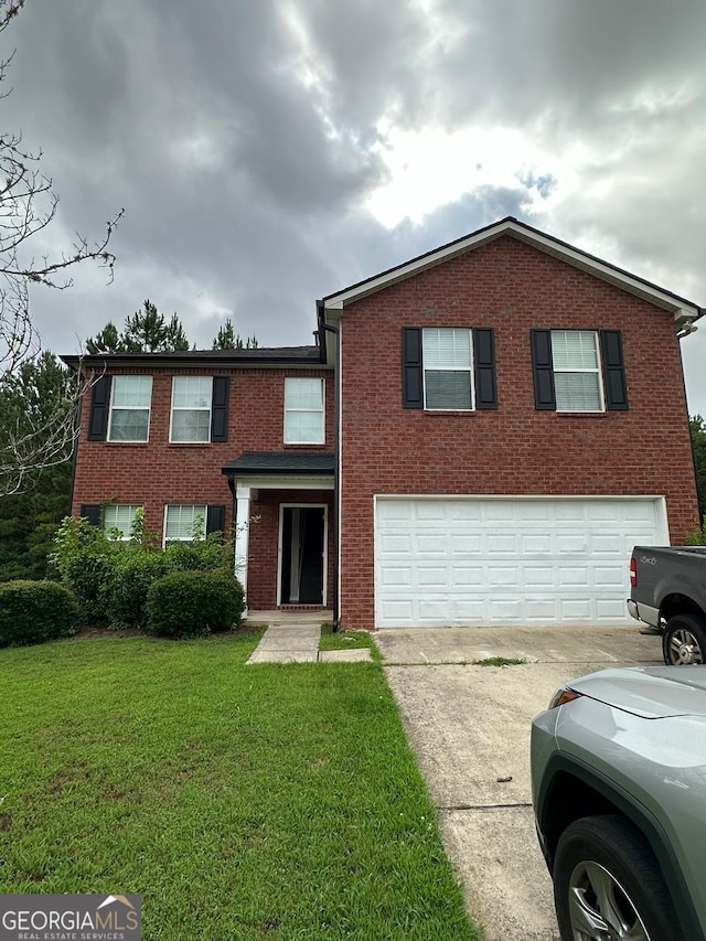 view of front of home with a front yard and a garage