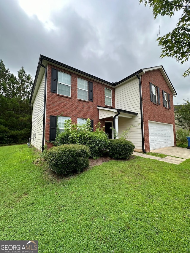 view of front of property featuring a garage and a front lawn