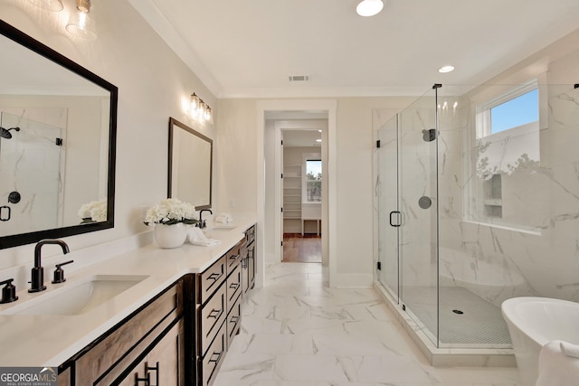 bathroom featuring independent shower and bath, ornamental molding, and vanity