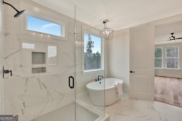 bathroom featuring separate shower and tub and ceiling fan