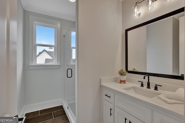 bathroom with a shower with door and vanity