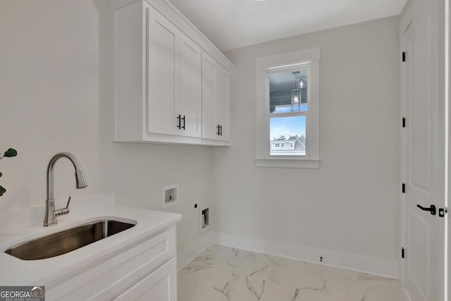 washroom with cabinets, washer hookup, hookup for an electric dryer, and sink