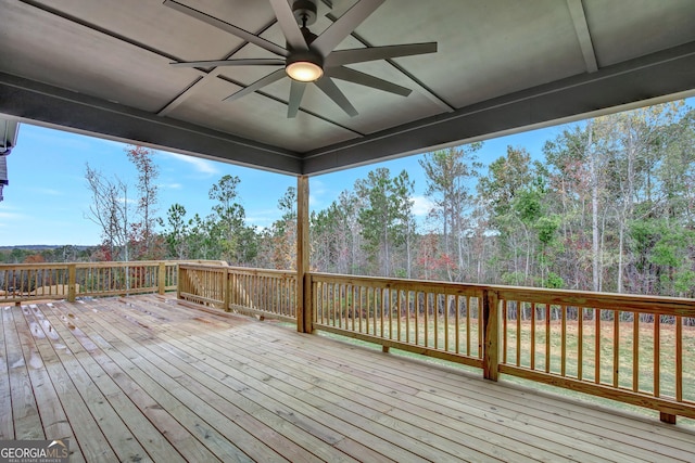 wooden deck featuring ceiling fan