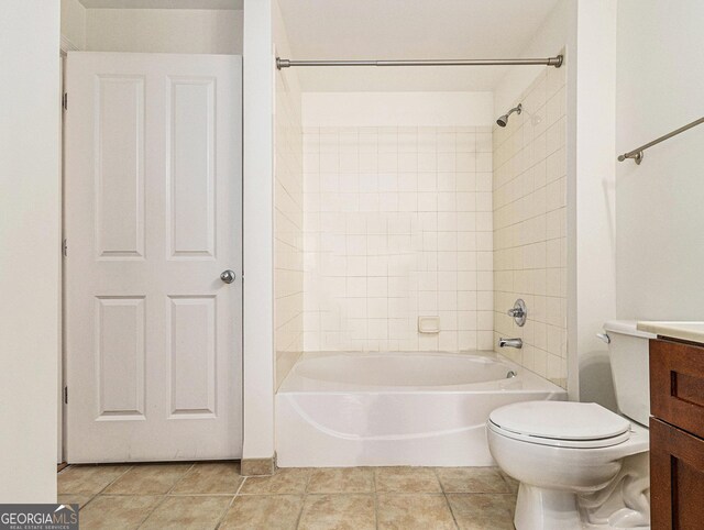 full bathroom featuring  shower combination, vanity, toilet, and tile patterned floors