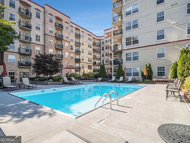 community pool featuring a patio area