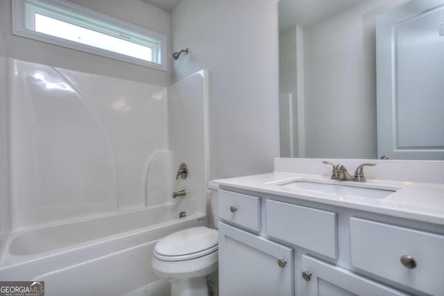 full bathroom featuring shower / washtub combination, vanity, and toilet