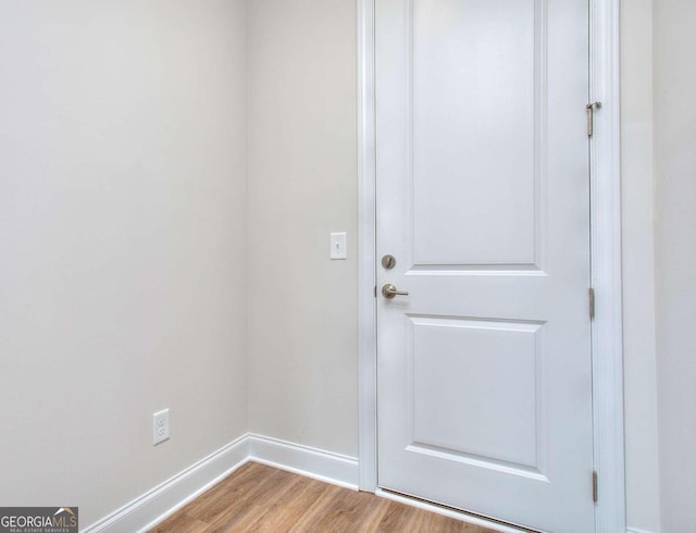 doorway to outside with wood-type flooring