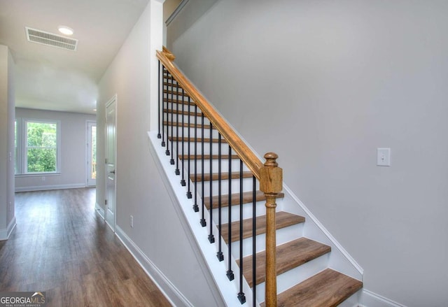 stairway with wood-type flooring