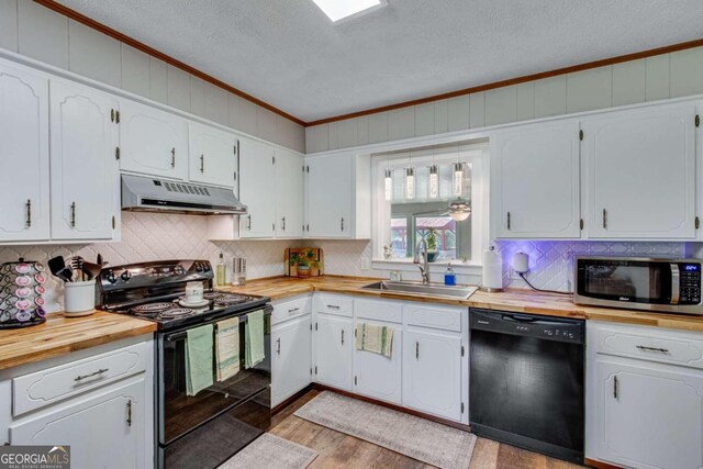 kitchen with light hardwood / wood-style flooring, black appliances, sink, a textured ceiling, and white cabinetry