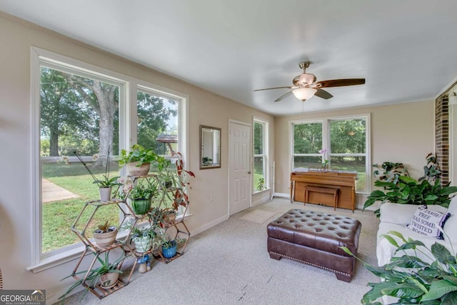 sunroom / solarium with ceiling fan