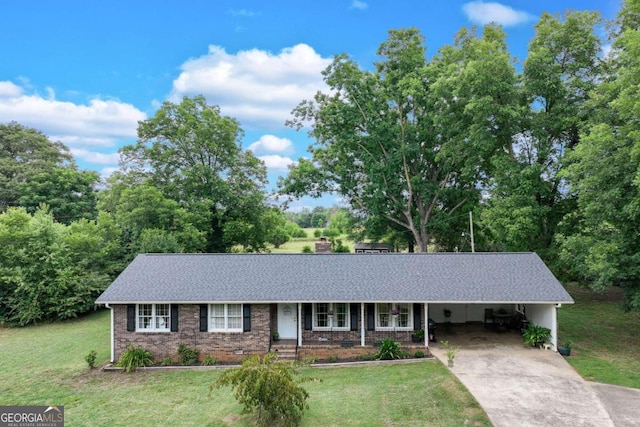 ranch-style house featuring a carport and a front lawn