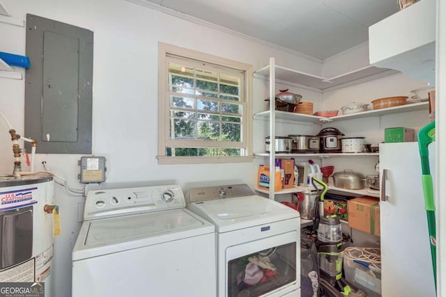 laundry room with electric water heater, electric panel, washer and clothes dryer, and ornamental molding