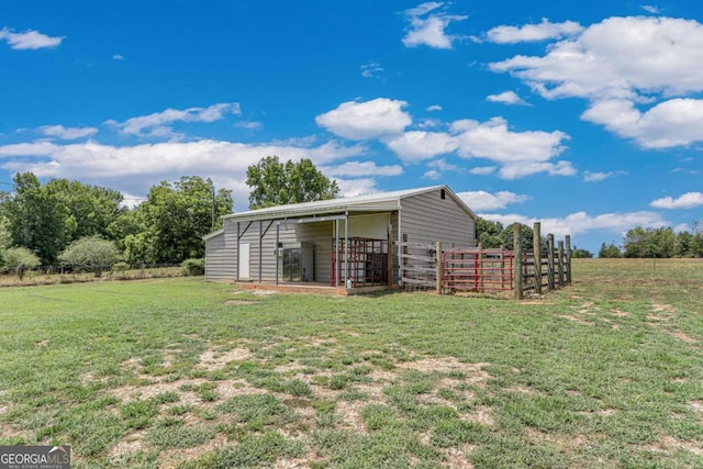 exterior space with a yard and an outdoor structure