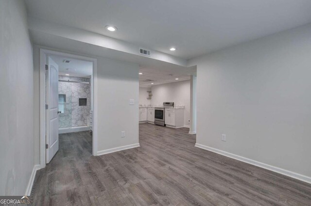 unfurnished living room with wood-type flooring