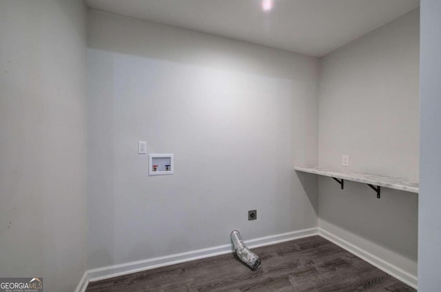 laundry room with dark wood-type flooring, hookup for a washing machine, and electric dryer hookup