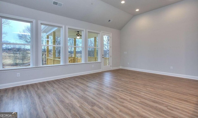 unfurnished room featuring recessed lighting, visible vents, wood finished floors, and baseboards