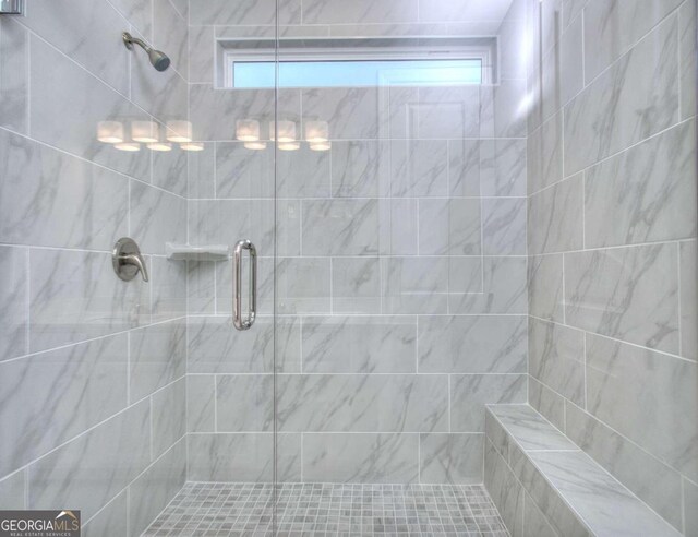 full bathroom featuring a stall shower