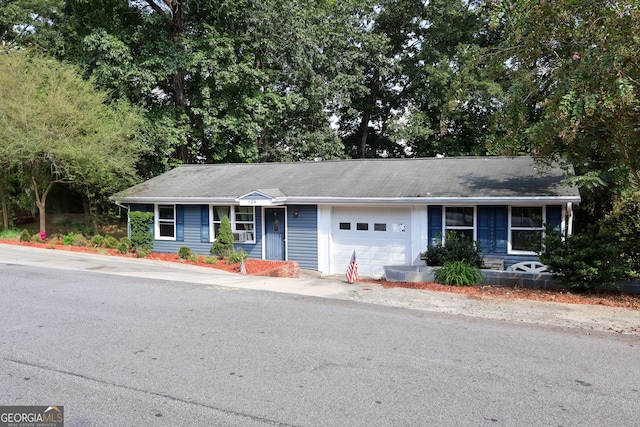 ranch-style home featuring a garage