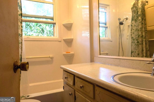 full bathroom with vanity, toilet, and shower / bathtub combination with curtain