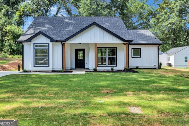 modern farmhouse style home with a front yard