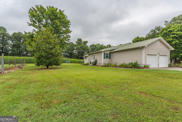 view of yard with a garage