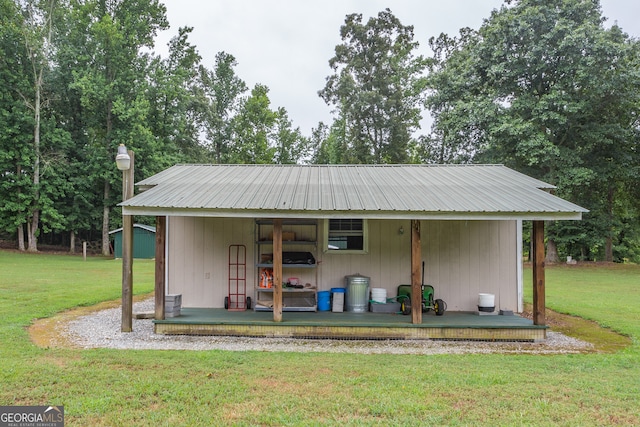 view of outbuilding featuring a lawn