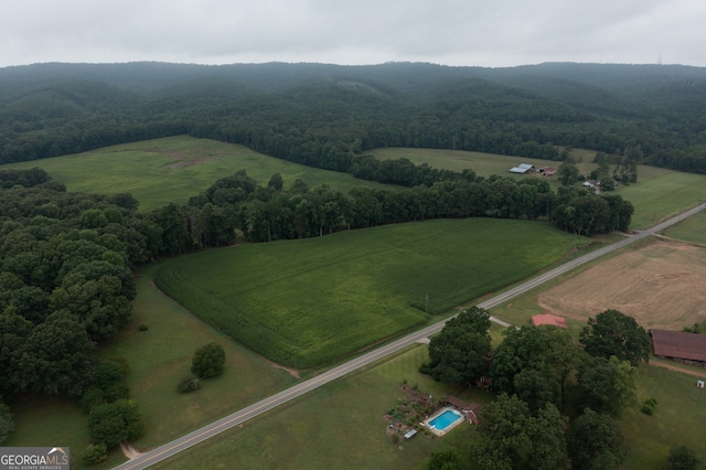 birds eye view of property with a rural view and a mountain view