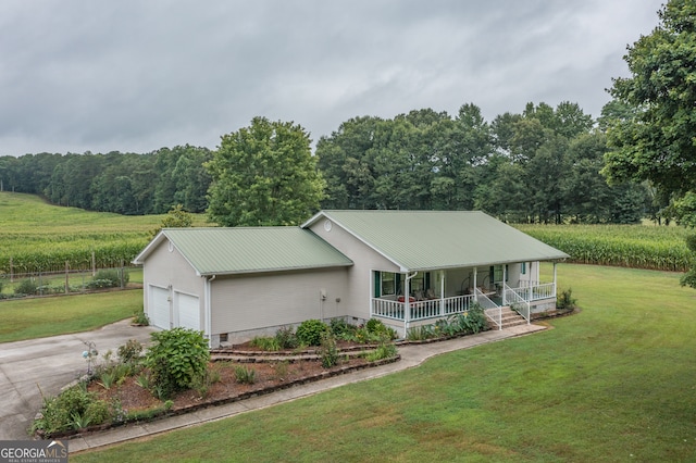 view of front of home with a porch and a front yard