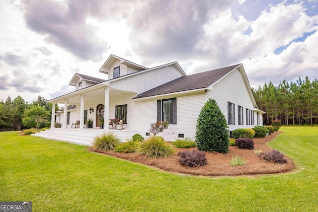 view of front of property with a porch and a front yard