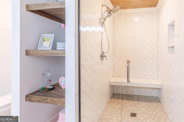 bathroom featuring walk in shower and wood ceiling