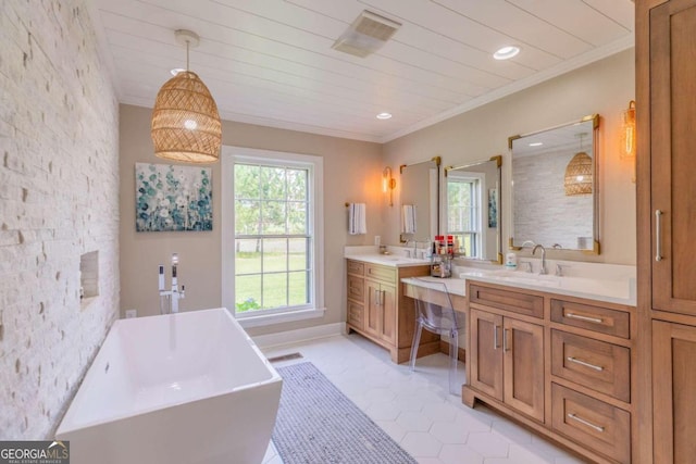 bathroom with vanity, ornamental molding, tile patterned floors, and a tub