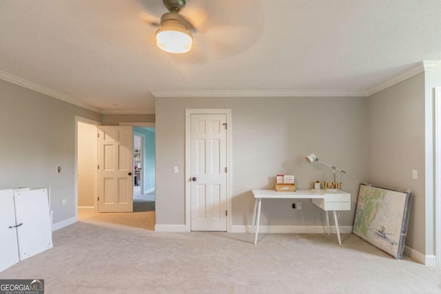 interior space featuring light colored carpet, ornamental molding, and ceiling fan