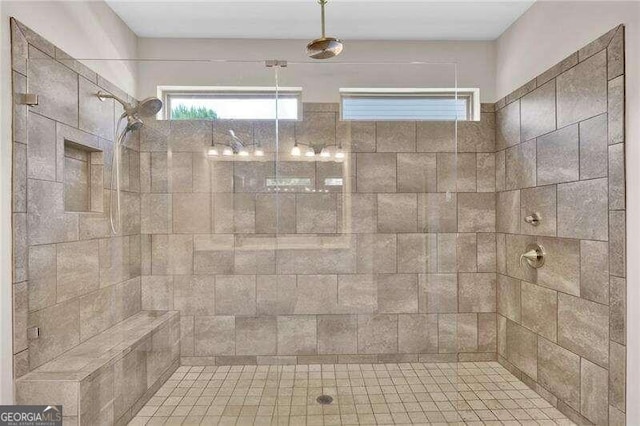 bathroom with a tile shower