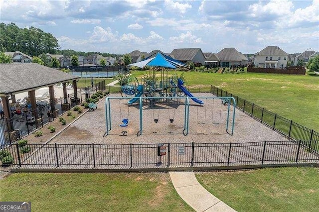 view of jungle gym with a lawn