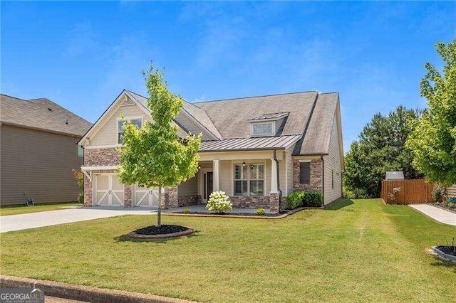 view of front of home featuring a front lawn and a garage