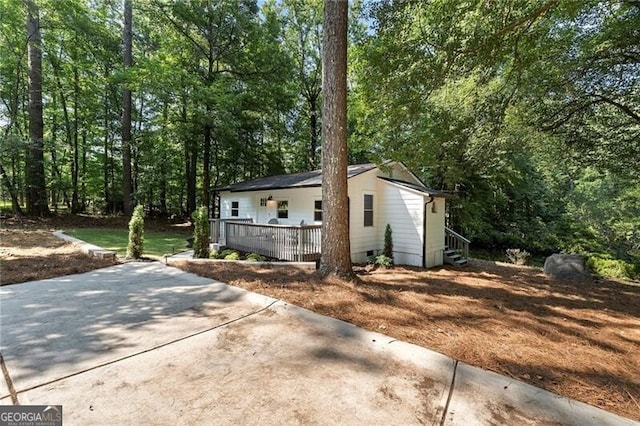 view of property exterior featuring a porch