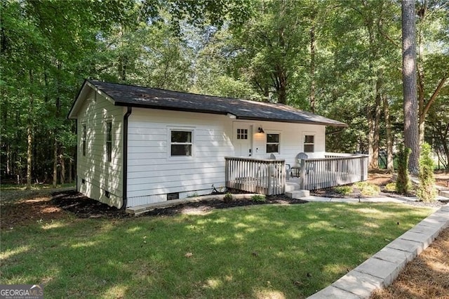 exterior space featuring a yard and a deck