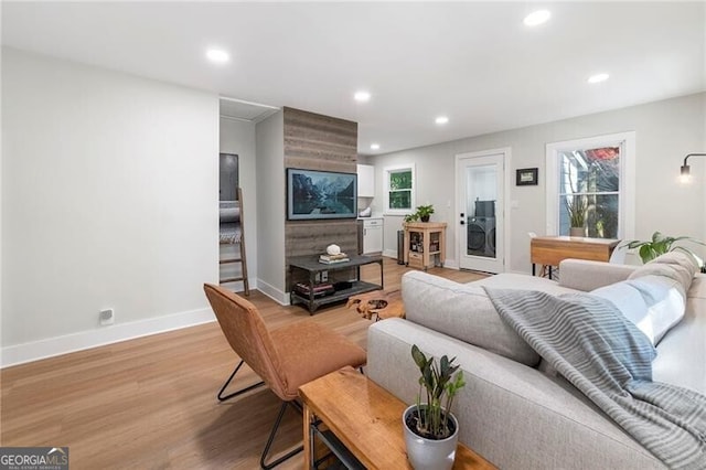 living room with light hardwood / wood-style flooring