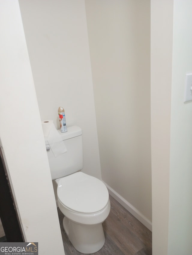 bathroom featuring toilet and hardwood / wood-style floors