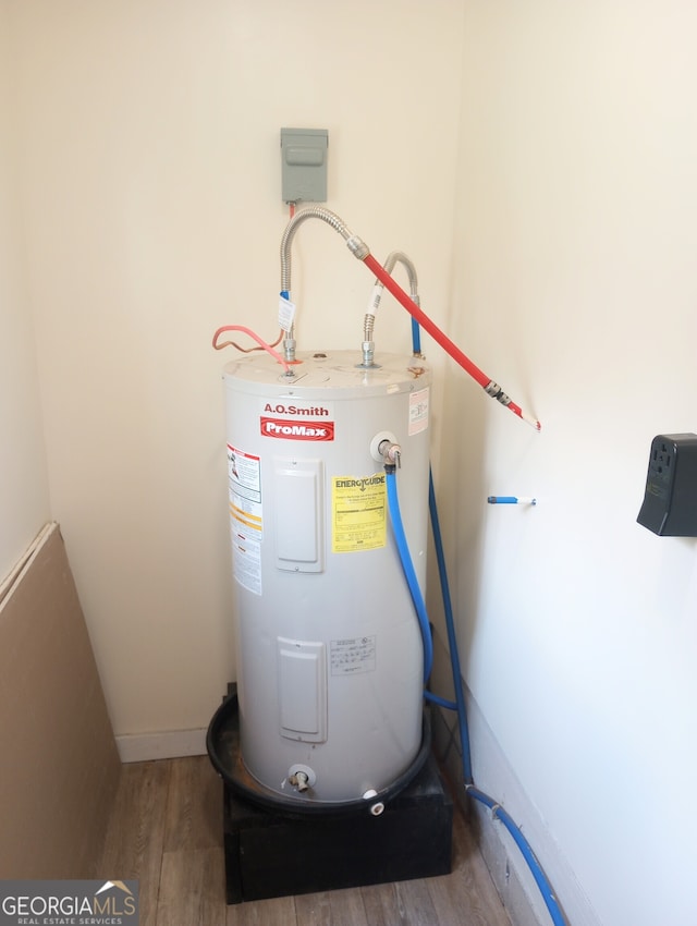 utility room featuring electric water heater