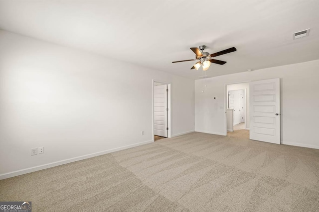 unfurnished bedroom featuring light carpet and ceiling fan