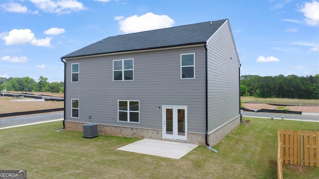 back of house with french doors, a yard, cooling unit, and a patio area