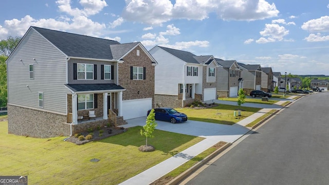 view of front of home with a garage and a front yard