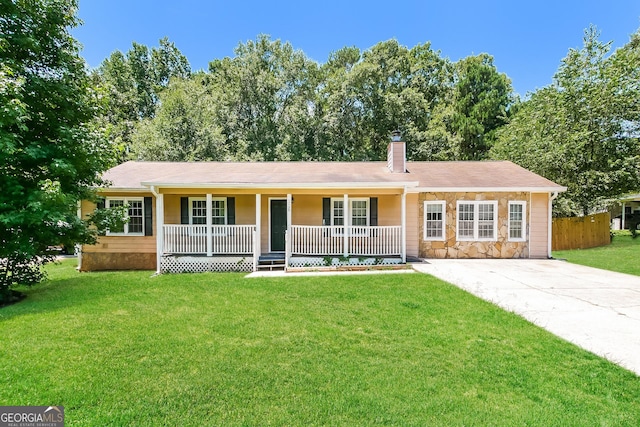 single story home with covered porch and a front lawn