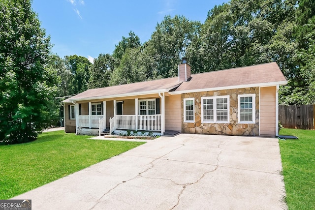 single story home with covered porch and a front lawn