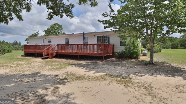 back of property featuring a deck