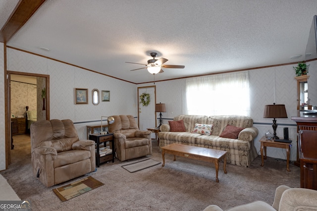 carpeted living room featuring crown molding, lofted ceiling, ceiling fan, and a textured ceiling