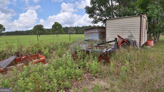 view of yard with a rural view