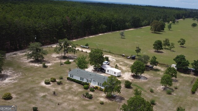 birds eye view of property with a rural view