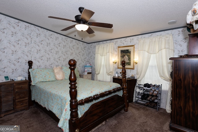 carpeted bedroom featuring ornamental molding, ceiling fan, and a textured ceiling